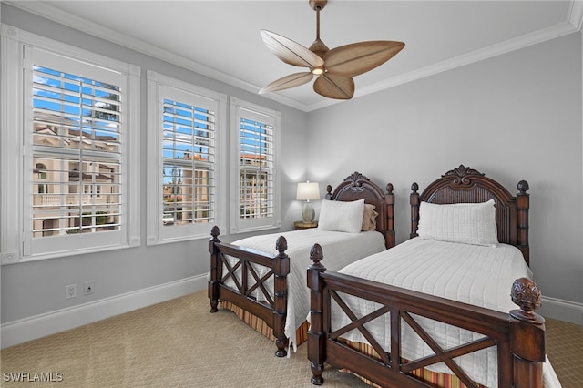 bedroom with carpet, ceiling fan, and ornamental molding