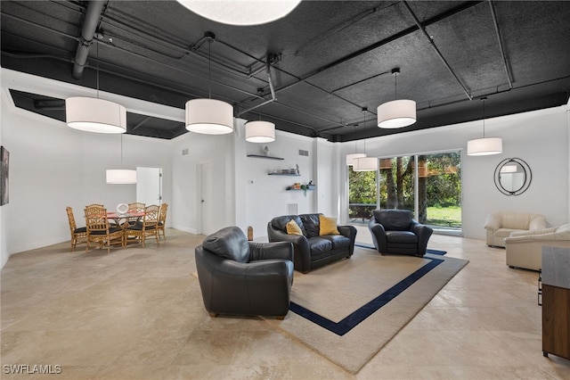 living room featuring a towering ceiling