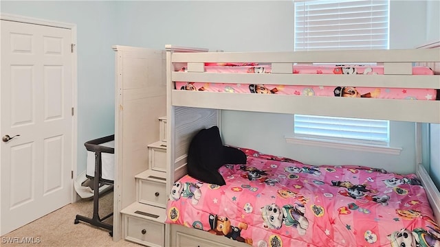 bedroom with light colored carpet