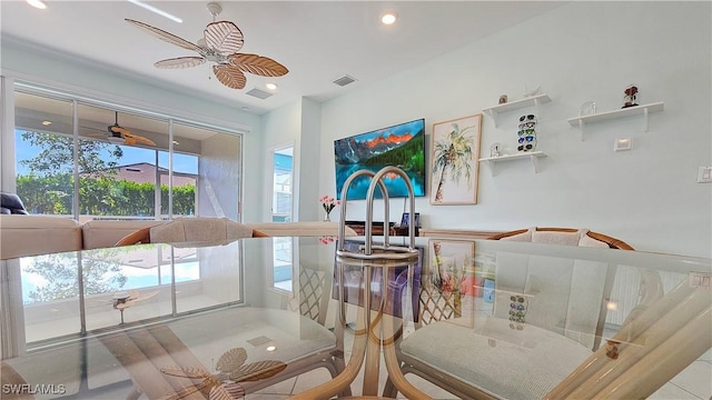 dining area featuring ceiling fan and light tile patterned floors