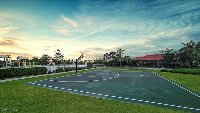 view of basketball court featuring a lawn