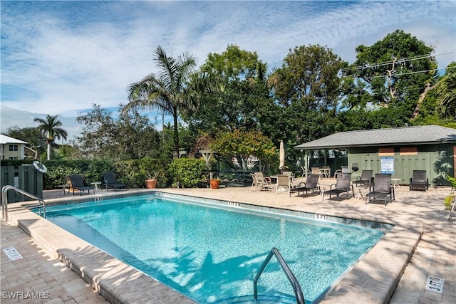 view of swimming pool with a patio area