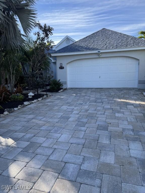 view of front of property with a garage