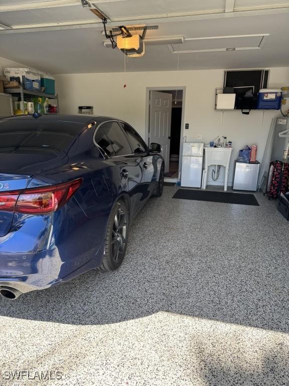 garage featuring a garage door opener