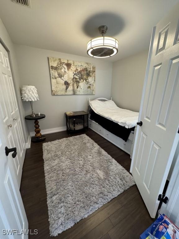 bedroom featuring dark hardwood / wood-style floors