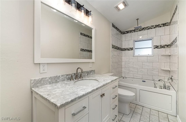 full bathroom featuring tiled shower / bath combo, toilet, vanity, and vaulted ceiling