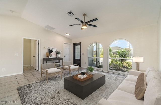 living room with light tile patterned floors, vaulted ceiling, and ceiling fan