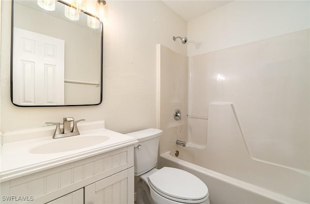 full bathroom featuring vanity, washtub / shower combination, and toilet