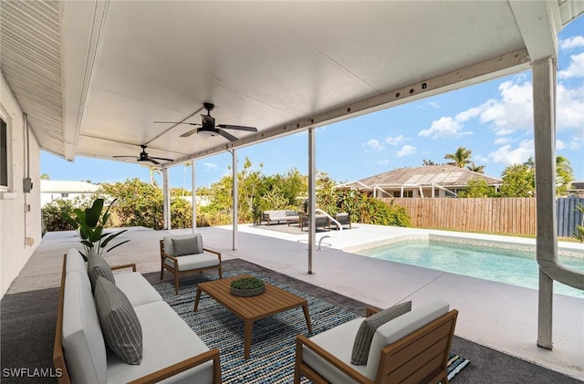 view of patio / terrace with a fenced in pool and outdoor lounge area