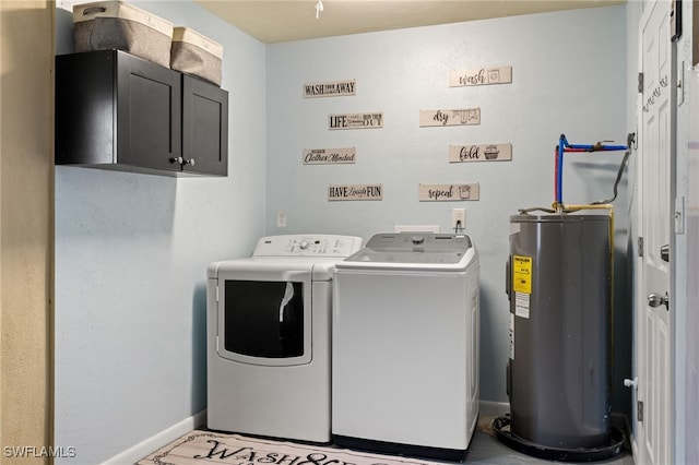 washroom featuring separate washer and dryer, cabinets, and electric water heater