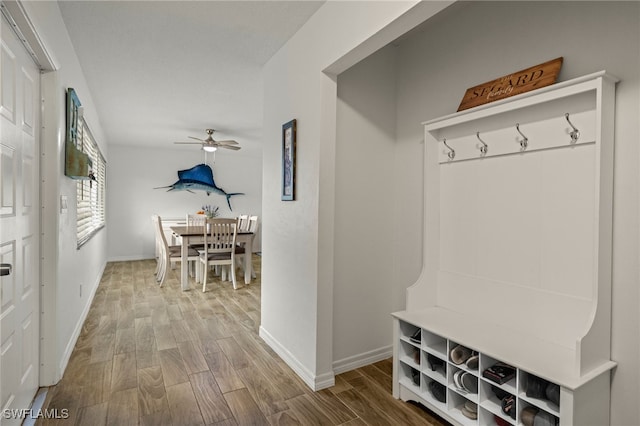 mudroom with ceiling fan and hardwood / wood-style floors