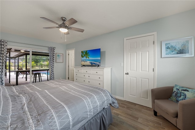 bedroom featuring ceiling fan, hardwood / wood-style floors, and access to outside