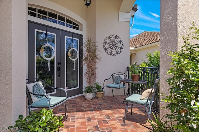 entrance to property featuring french doors