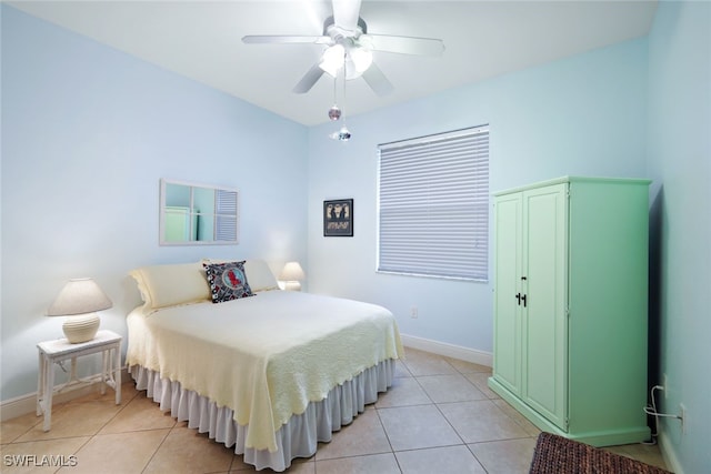 tiled bedroom featuring ceiling fan