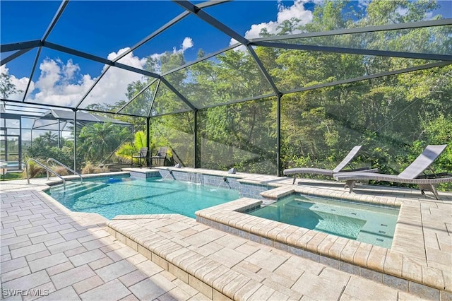 view of swimming pool featuring a lanai, a patio area, an in ground hot tub, and pool water feature