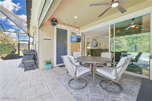 sunroom / solarium with ceiling fan