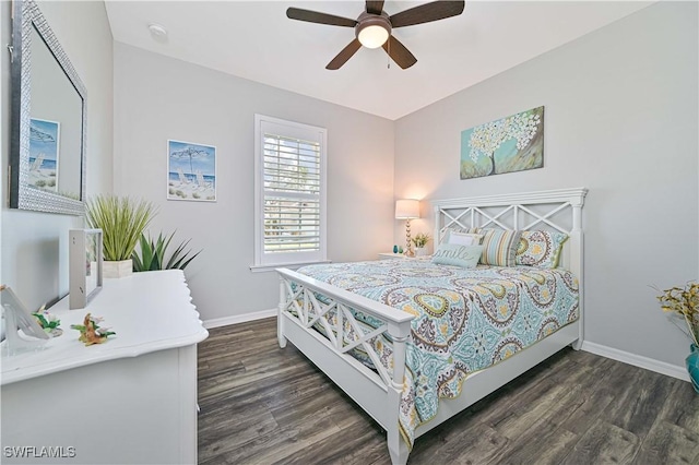 bedroom with ceiling fan and dark hardwood / wood-style flooring