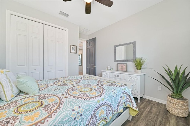 bedroom featuring dark hardwood / wood-style flooring, a closet, and ceiling fan