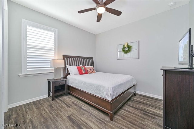 bedroom with ceiling fan and dark hardwood / wood-style flooring