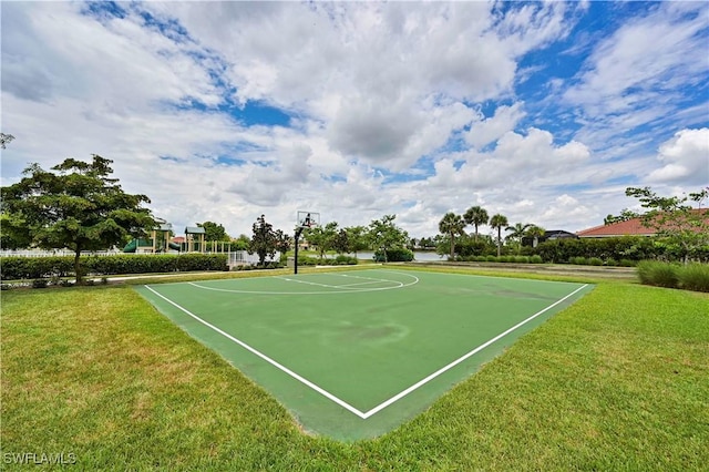 view of basketball court featuring a lawn