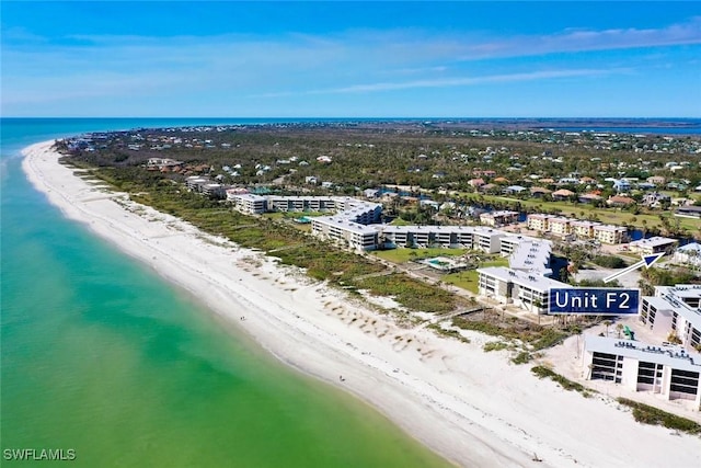 drone / aerial view with a view of the beach and a water view