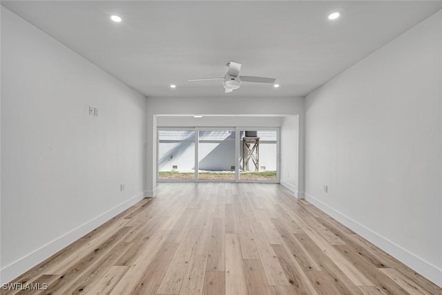 interior space with recessed lighting, light wood-type flooring, and baseboards