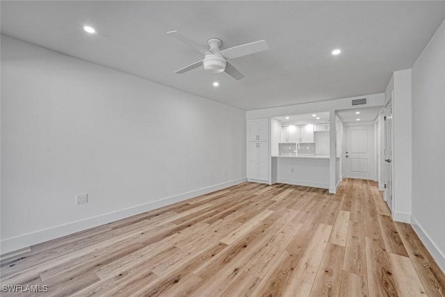 unfurnished living room featuring visible vents, baseboards, ceiling fan, light wood-style floors, and recessed lighting