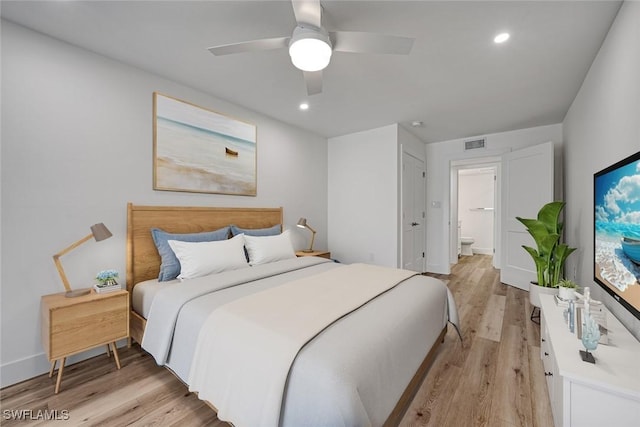 bedroom featuring light wood finished floors, recessed lighting, visible vents, a ceiling fan, and connected bathroom