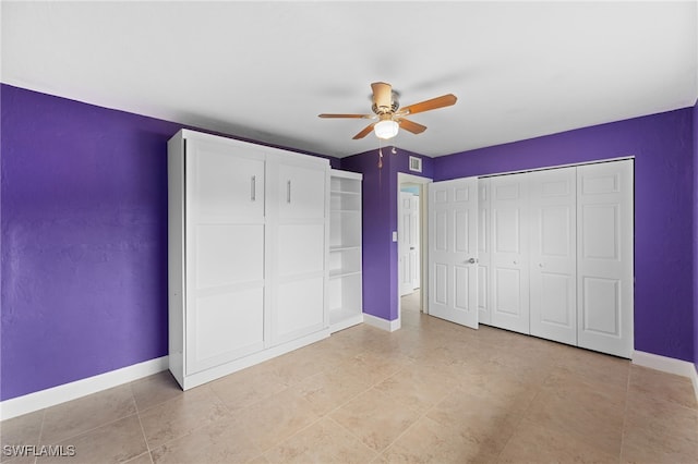 unfurnished bedroom featuring ceiling fan