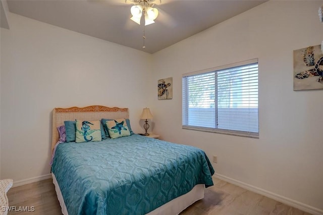 bedroom featuring wood-type flooring and ceiling fan