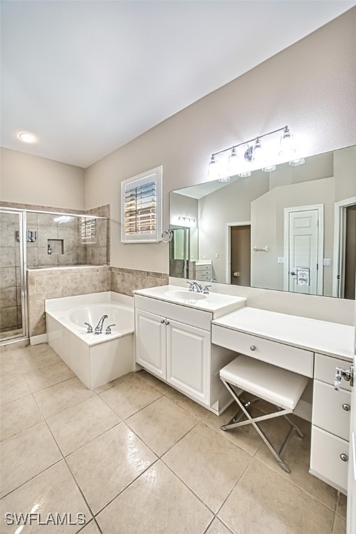 bathroom with tile patterned flooring, vanity, and independent shower and bath