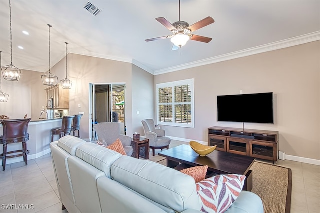 living room with crown molding, light tile patterned floors, and ceiling fan