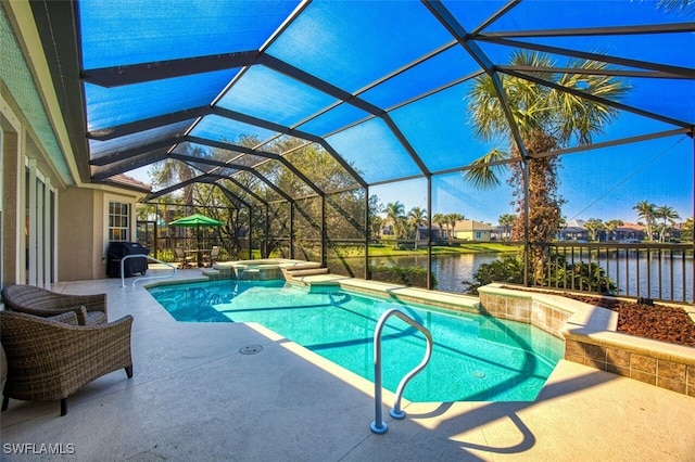 view of pool with grilling area, a water view, a lanai, an in ground hot tub, and a patio area