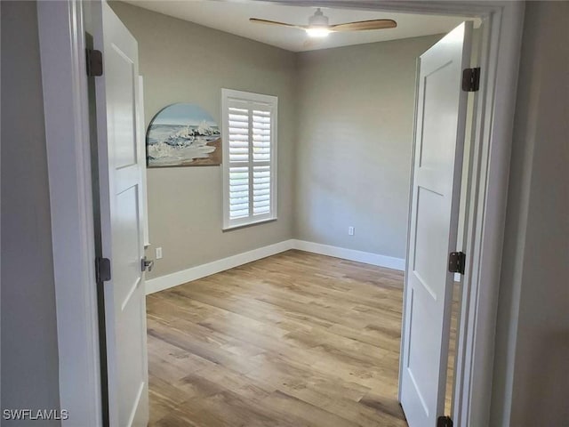 spare room with ceiling fan and light hardwood / wood-style floors