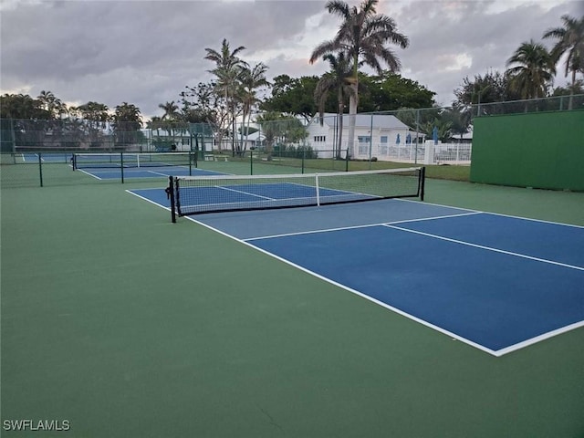 view of tennis court featuring basketball court