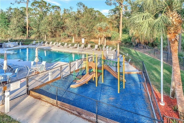 view of pool featuring a playground