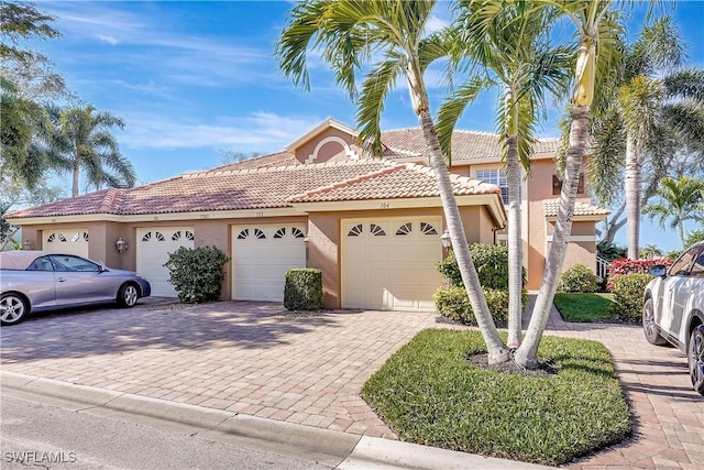 mediterranean / spanish-style house featuring a garage