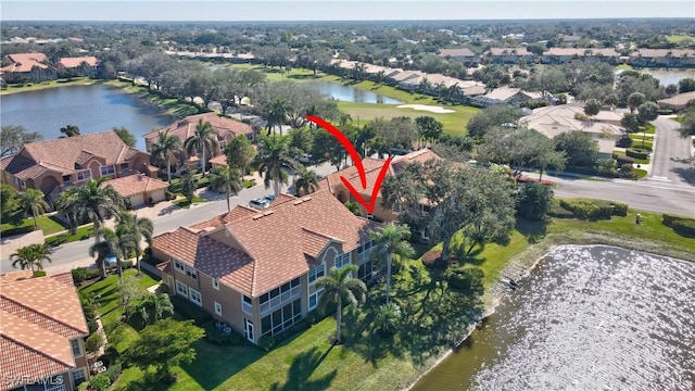 birds eye view of property featuring a water view