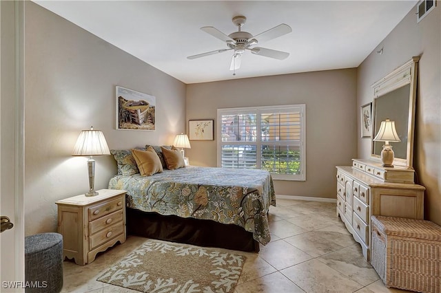 tiled bedroom featuring ceiling fan