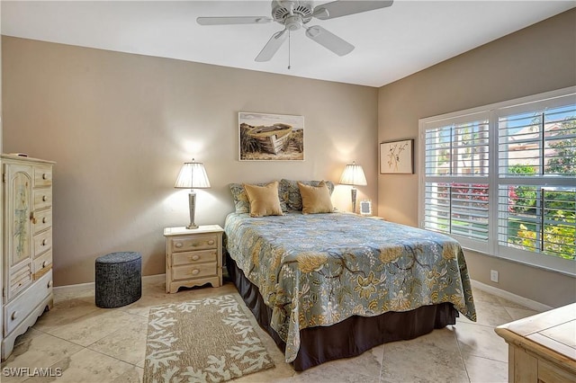 tiled bedroom with ceiling fan