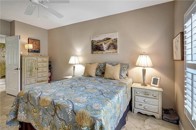 bedroom with multiple windows, ceiling fan, and light tile patterned flooring