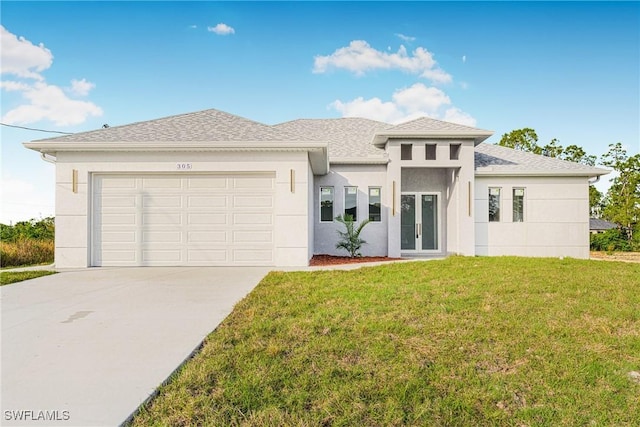 view of front of house featuring a front lawn and a garage