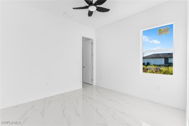 unfurnished room featuring ceiling fan