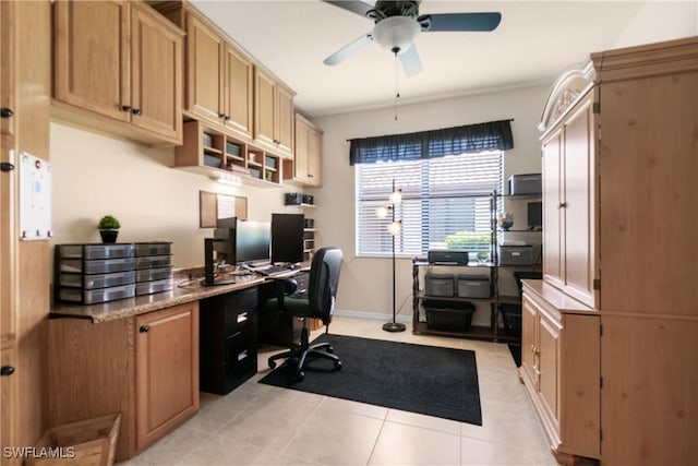 tiled office space featuring ceiling fan