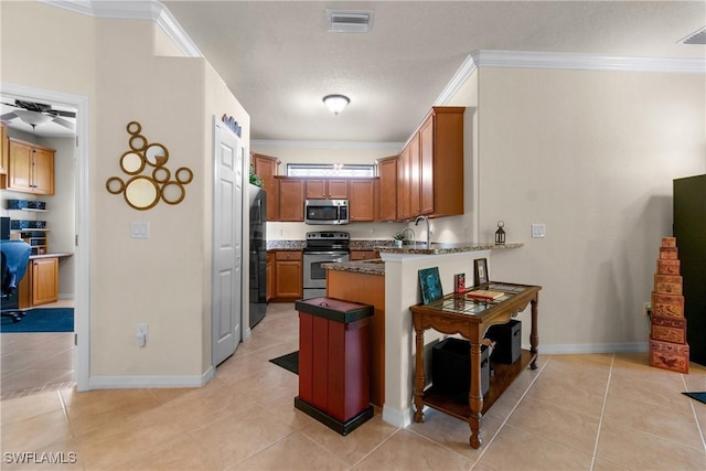 kitchen featuring kitchen peninsula, stainless steel appliances, and light tile patterned flooring