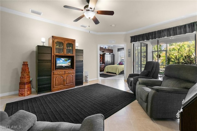 living room with ceiling fan, crown molding, and light tile patterned flooring