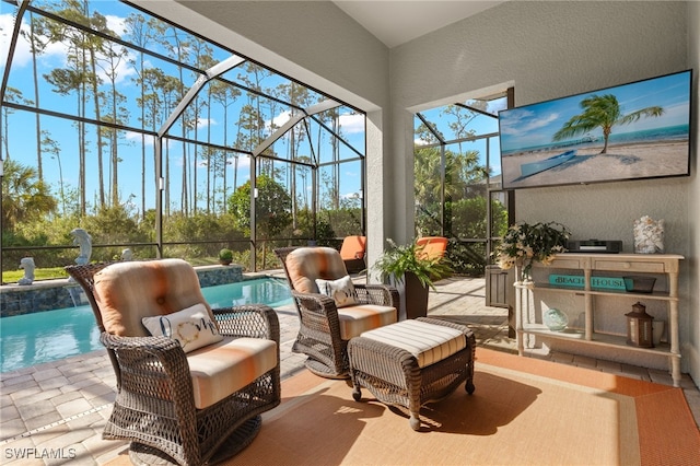 sunroom with a pool and plenty of natural light