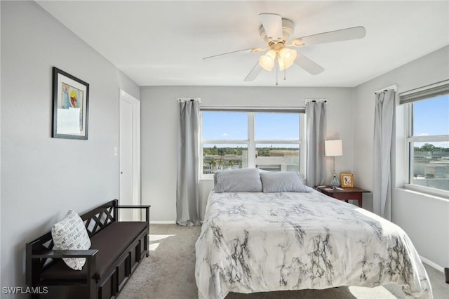 carpeted bedroom with ceiling fan