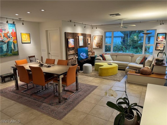 dining space with ceiling fan, light tile patterned floors, and track lighting