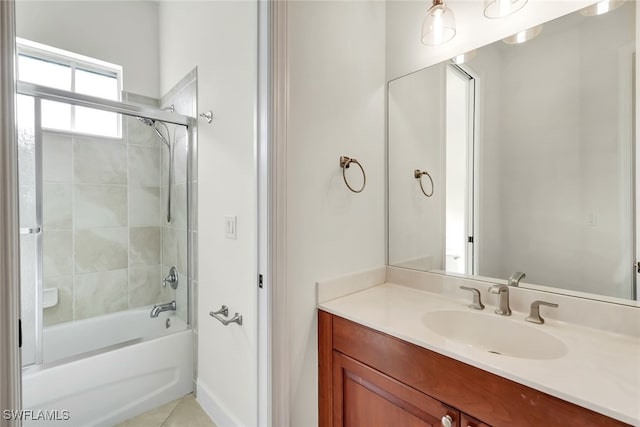 bathroom featuring shower / bath combination with glass door, vanity, and tile patterned flooring